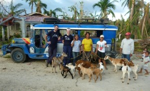 The team stands in front of a jeepney, a local taxi commonly used in the Philippines, the third of three field clinics sites in Dapdap, Daanbantayan