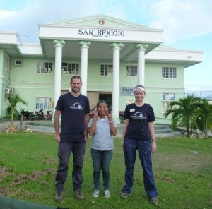 World Vets veterinarians stand with LaLei, a recently graduated Filipino veterinarian who helped them with field clinics for the day.