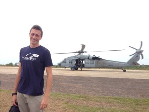 World Vets veterinarian, Dr. Mitch Cooper, gets ready to travel on a helicopter